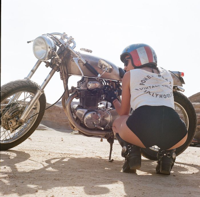 A playful frame from Girls on a motorcycle — online in Jakarta